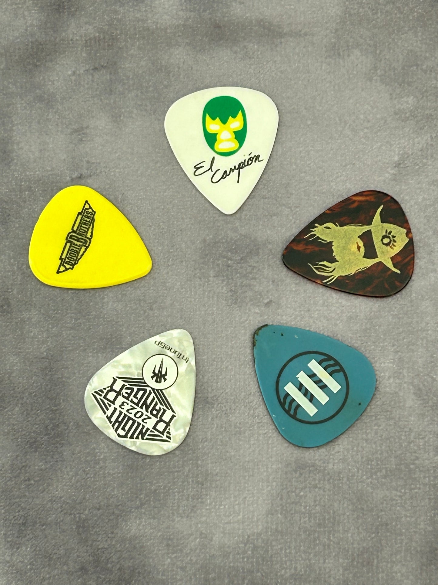 5 guitar pick assortment - all have been used by respective acts